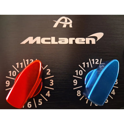 Detail close-up of the steering wheel controls in red, blue, and black.