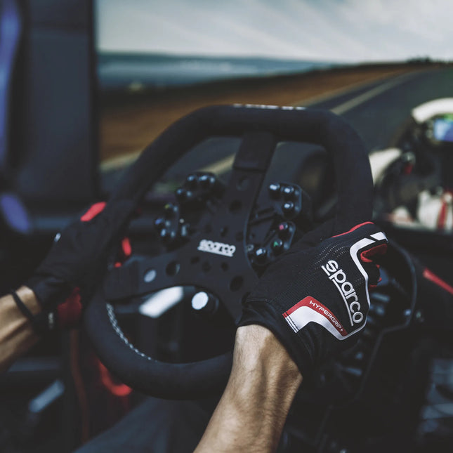 Close-up of black and red full-finger racing gloves with grip texture.