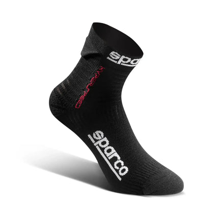 Detail of black racing socks with red logo on a white background