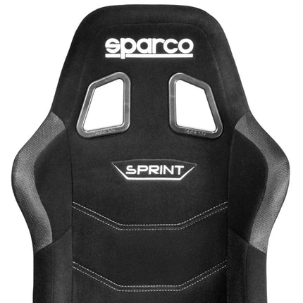 Close-up of the black Sparco Sprint sim racing seat showing logo and stitching details.